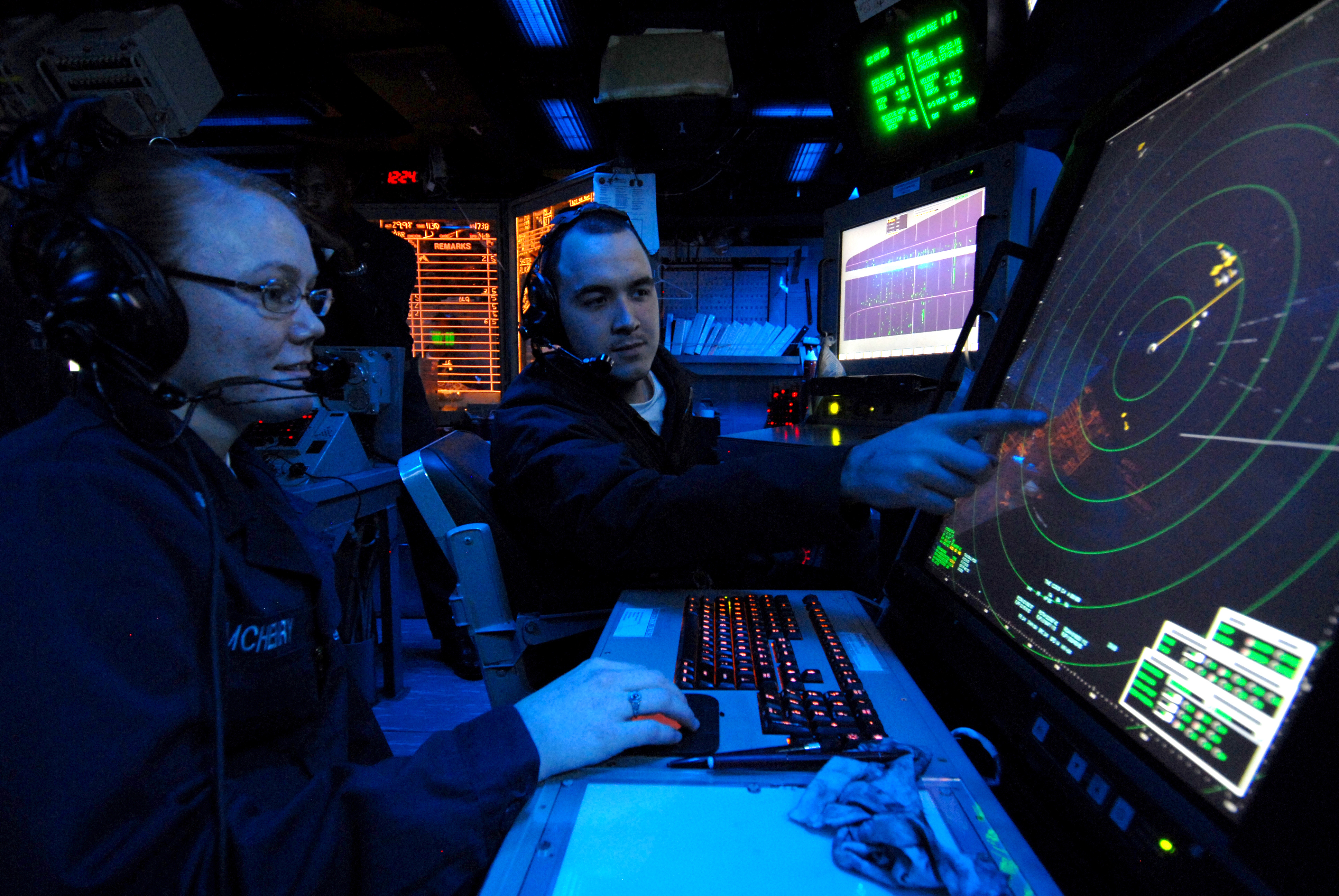 081117-N-9950J-004 EAST CHINA SEA (Nov. 17, 2008) Air Traffic Controller 2nd Class Erin McHenry, of Wichita, Kan., and Air Traffic Controller Airman Apprentice Adam Minkel, of Pipestone, Minn., track aircraft on a radar console in the amphibious air traffic control center aboard the forward-deployed amphibious assault ship USS Essex (LHD 2). Air-traffic controllers aboard Essex monitor all air traffic within a 220-mile radius. U.S. Navy photo by Mass Communication Specialist 2nd Class Greg Johnson (Released)